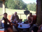 Larry, Gadget & Greg relaxing in the screened in porch at the cabin.